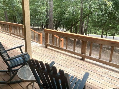 Situated on a hill, this one owner, two lot home allows for the on Holly Lake Ranch Golf Club in Texas - for sale on GolfHomes.com, golf home, golf lot