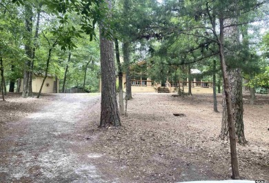 Situated on a hill, this one owner, two lot home allows for the on Holly Lake Ranch Golf Club in Texas - for sale on GolfHomes.com, golf home, golf lot