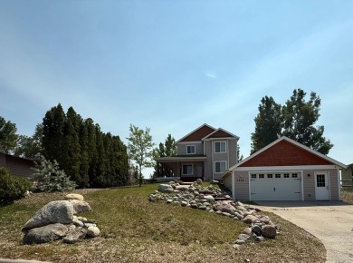 Welcome to this stunning 4-bedroom, 4-bathroom home nestled on Sidney Country Club in Montana - for sale on GolfHomes.com, golf home, golf lot