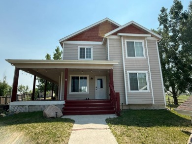 Welcome to this stunning 4-bedroom, 4-bathroom home nestled on Sidney Country Club in Montana - for sale on GolfHomes.com, golf home, golf lot