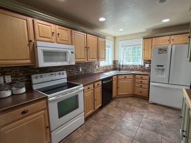 Welcome to this stunning 4-bedroom, 4-bathroom home nestled on Sidney Country Club in Montana - for sale on GolfHomes.com, golf home, golf lot