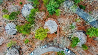 TREETOPPER *BLESSINGS* These octagonal shaped homes with floor on Big Canoe Golf Club - Cherokee in Georgia - for sale on GolfHomes.com, golf home, golf lot