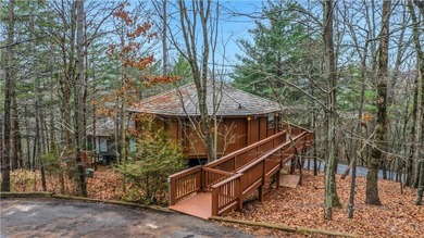 TREETOPPER *BLESSINGS* These octagonal shaped homes with floor on Big Canoe Golf Club - Cherokee in Georgia - for sale on GolfHomes.com, golf home, golf lot