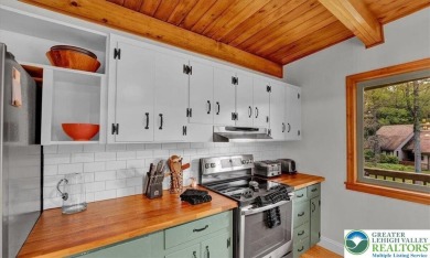 Step into this 3-bedroom, 2-bath Lake Harmony home showcasing on Split Rock Resort and Country Club in Pennsylvania - for sale on GolfHomes.com, golf home, golf lot