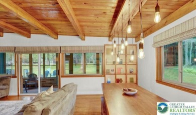 Step into this 3-bedroom, 2-bath Lake Harmony home showcasing on Split Rock Resort and Country Club in Pennsylvania - for sale on GolfHomes.com, golf home, golf lot