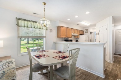 This spacious and well-maintained first-floor end unit features on River Oaks Golf Plantation  in South Carolina - for sale on GolfHomes.com, golf home, golf lot