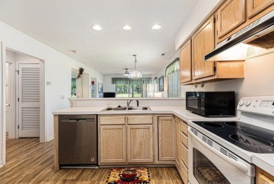 This spacious and well-maintained first-floor end unit features on River Oaks Golf Plantation  in South Carolina - for sale on GolfHomes.com, golf home, golf lot