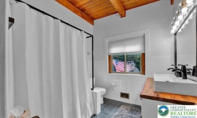 Step into this 3-bedroom, 2-bath Lake Harmony home showcasing on Split Rock Resort and Country Club in Pennsylvania - for sale on GolfHomes.com, golf home, golf lot