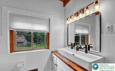 Step into this 3-bedroom, 2-bath Lake Harmony home showcasing on Split Rock Resort and Country Club in Pennsylvania - for sale on GolfHomes.com, golf home, golf lot