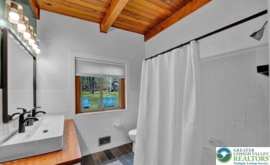 Step into this 3-bedroom, 2-bath Lake Harmony home showcasing on Split Rock Resort and Country Club in Pennsylvania - for sale on GolfHomes.com, golf home, golf lot