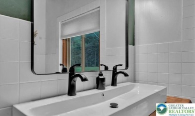Step into this 3-bedroom, 2-bath Lake Harmony home showcasing on Split Rock Resort and Country Club in Pennsylvania - for sale on GolfHomes.com, golf home, golf lot
