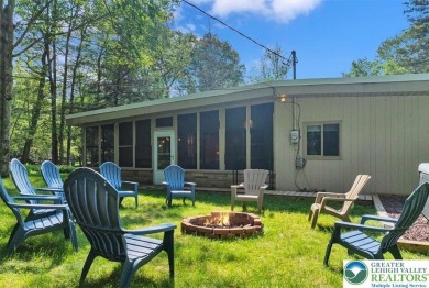 Step into this 3-bedroom, 2-bath Lake Harmony home showcasing on Split Rock Resort and Country Club in Pennsylvania - for sale on GolfHomes.com, golf home, golf lot
