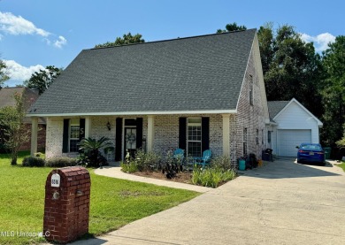 Fantastic home with lots of space located across the street fro on Diamondhead Country Club in Mississippi - for sale on GolfHomes.com, golf home, golf lot