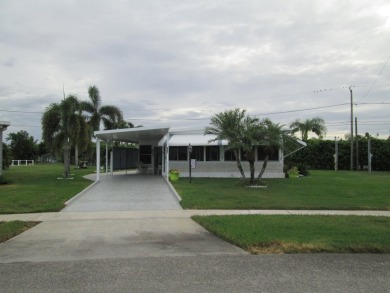 HUGE CORNER LOT PROPERTY WITH A PRIVATE DOCK & WITH A BEAUTIFUL on Cypress Creek Country Club - Boynton Beach in Florida - for sale on GolfHomes.com, golf home, golf lot