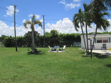 HUGE CORNER LOT PROPERTY WITH A PRIVATE DOCK & WITH A BEAUTIFUL on Cypress Creek Country Club - Boynton Beach in Florida - for sale on GolfHomes.com, golf home, golf lot