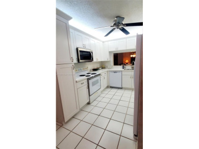 Beautiful GROUND FLOOR  2 bed 2 bath INSIDE CORNER UNIT in an on Sunrise Lakes Phase IV Golf Course in Florida - for sale on GolfHomes.com, golf home, golf lot