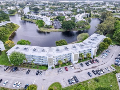 Recently renovated modern condo with new kitchen cabinets on Hillsboro Pines Golf in Florida - for sale on GolfHomes.com, golf home, golf lot