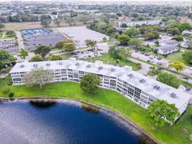 Recently renovated modern condo with new kitchen cabinets on Hillsboro Pines Golf in Florida - for sale on GolfHomes.com, golf home, golf lot
