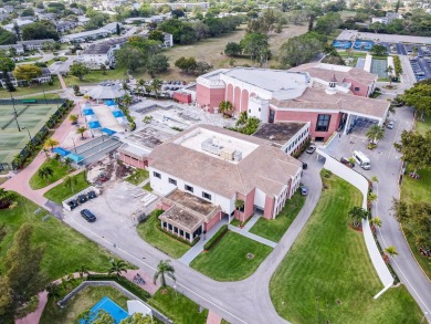 Recently renovated modern condo with new kitchen cabinets on Hillsboro Pines Golf in Florida - for sale on GolfHomes.com, golf home, golf lot