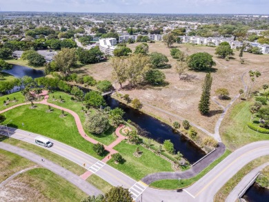 Recently renovated modern condo with new kitchen cabinets on Hillsboro Pines Golf in Florida - for sale on GolfHomes.com, golf home, golf lot
