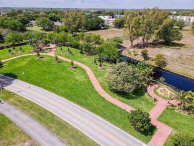 Recently renovated modern condo with new kitchen cabinets on Hillsboro Pines Golf in Florida - for sale on GolfHomes.com, golf home, golf lot