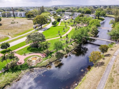 Recently renovated modern condo with new kitchen cabinets on Hillsboro Pines Golf in Florida - for sale on GolfHomes.com, golf home, golf lot