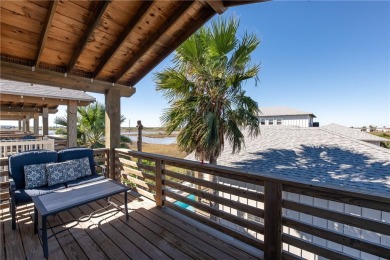 This stunning turnkey beach house is your ideal sunset retreat! on Palmilla Beach Golf Club in Texas - for sale on GolfHomes.com, golf home, golf lot