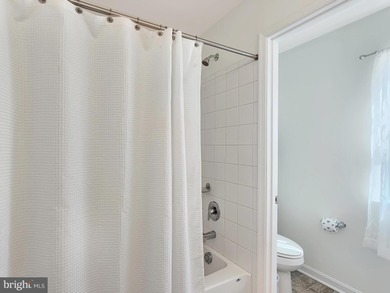 Charming 4-Bedroom Home with Stunning Bay Views in Captains Cove on Captains Cove Golf and Yacht Club in Virginia - for sale on GolfHomes.com, golf home, golf lot