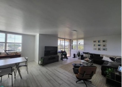 Welcome to this gut-renovated 2-bedroom, 2-bathroom penthouse on The Club at Emerald Hills in Florida - for sale on GolfHomes.com, golf home, golf lot