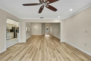This charming villa, located on the first hole of the Grand on Timber Pines Golf Course in Florida - for sale on GolfHomes.com, golf home, golf lot