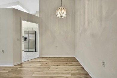 This charming villa, located on the first hole of the Grand on Timber Pines Golf Course in Florida - for sale on GolfHomes.com, golf home, golf lot