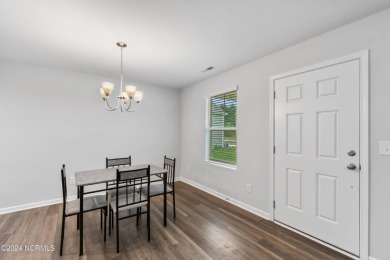 Discover this nearly new, charming single-level home with a low on Lennon Hills Golf Course in North Carolina - for sale on GolfHomes.com, golf home, golf lot