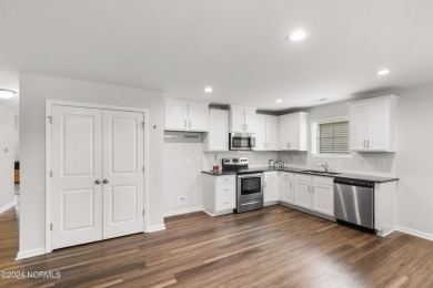 Discover this nearly new, charming single-level home with a low on Lennon Hills Golf Course in North Carolina - for sale on GolfHomes.com, golf home, golf lot