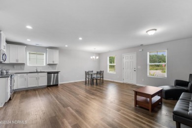 Discover this nearly new, charming single-level home with a low on Lennon Hills Golf Course in North Carolina - for sale on GolfHomes.com, golf home, golf lot
