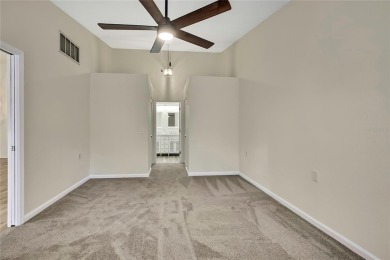 This charming villa, located on the first hole of the Grand on Timber Pines Golf Course in Florida - for sale on GolfHomes.com, golf home, golf lot