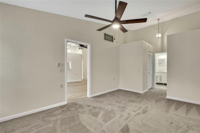 This charming villa, located on the first hole of the Grand on Timber Pines Golf Course in Florida - for sale on GolfHomes.com, golf home, golf lot
