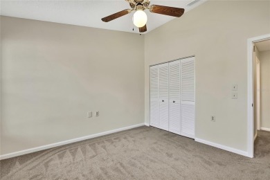 This charming villa, located on the first hole of the Grand on Timber Pines Golf Course in Florida - for sale on GolfHomes.com, golf home, golf lot