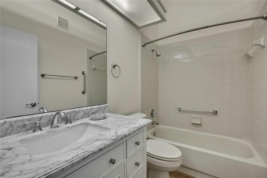 This charming villa, located on the first hole of the Grand on Timber Pines Golf Course in Florida - for sale on GolfHomes.com, golf home, golf lot