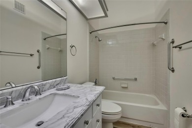 This charming villa, located on the first hole of the Grand on Timber Pines Golf Course in Florida - for sale on GolfHomes.com, golf home, golf lot
