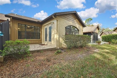 This charming villa, located on the first hole of the Grand on Timber Pines Golf Course in Florida - for sale on GolfHomes.com, golf home, golf lot