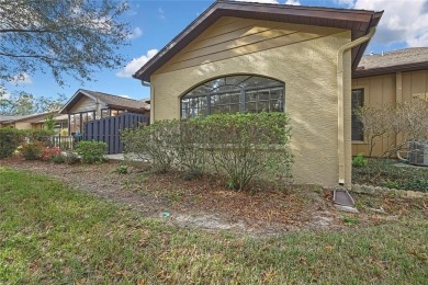 This charming villa, located on the first hole of the Grand on Timber Pines Golf Course in Florida - for sale on GolfHomes.com, golf home, golf lot