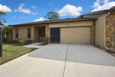This charming villa, located on the first hole of the Grand on Timber Pines Golf Course in Florida - for sale on GolfHomes.com, golf home, golf lot