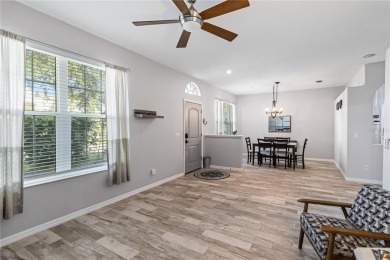 Enjoy serene preserve and golf course views in this elegant on River Strand Golf and Country Club At Heritage Harbour  in Florida - for sale on GolfHomes.com, golf home, golf lot