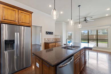 This one has it ALL! Situated on a large corner lot, this 4-bed on Centennial Valley Golf Course in Arkansas - for sale on GolfHomes.com, golf home, golf lot