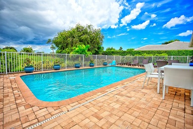 Stunning golf course views, 3 bedroom, 3 full bath home. Primary on Atlantis Golf Club in Florida - for sale on GolfHomes.com, golf home, golf lot