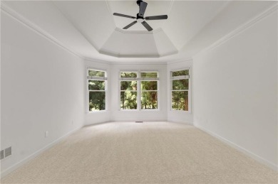 This beautiful home overlooks the golf course with primary on on The Golf Club of Georgia in Georgia - for sale on GolfHomes.com, golf home, golf lot