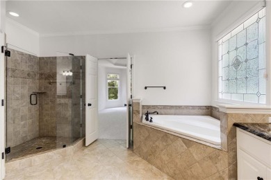 This beautiful home overlooks the golf course with primary on on The Golf Club of Georgia in Georgia - for sale on GolfHomes.com, golf home, golf lot