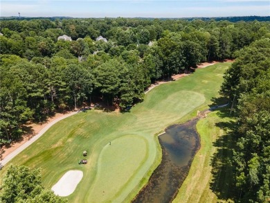 This beautiful home overlooks the golf course with primary on on The Golf Club of Georgia in Georgia - for sale on GolfHomes.com, golf home, golf lot