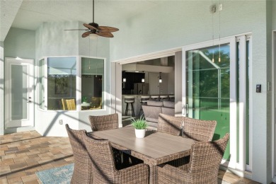 Set amidst private preserve and golf views, this better-than-new on Royal Tee Country Club in Florida - for sale on GolfHomes.com, golf home, golf lot