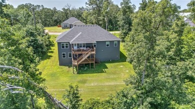 Tucked into the wooded hills of Bella Vista, this home delivers on Bella Vista Country Club - Highlands in Arkansas - for sale on GolfHomes.com, golf home, golf lot